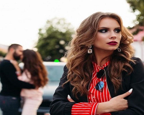 Psychic Solo performing a black magic spell to stop cheating, featuring a black candle, a locked padlock, and traditional African spiritual tools.