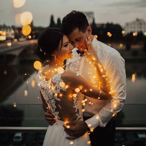 Psychic Solo performing a marriage spell ritual with red and white candles for a US-based client.