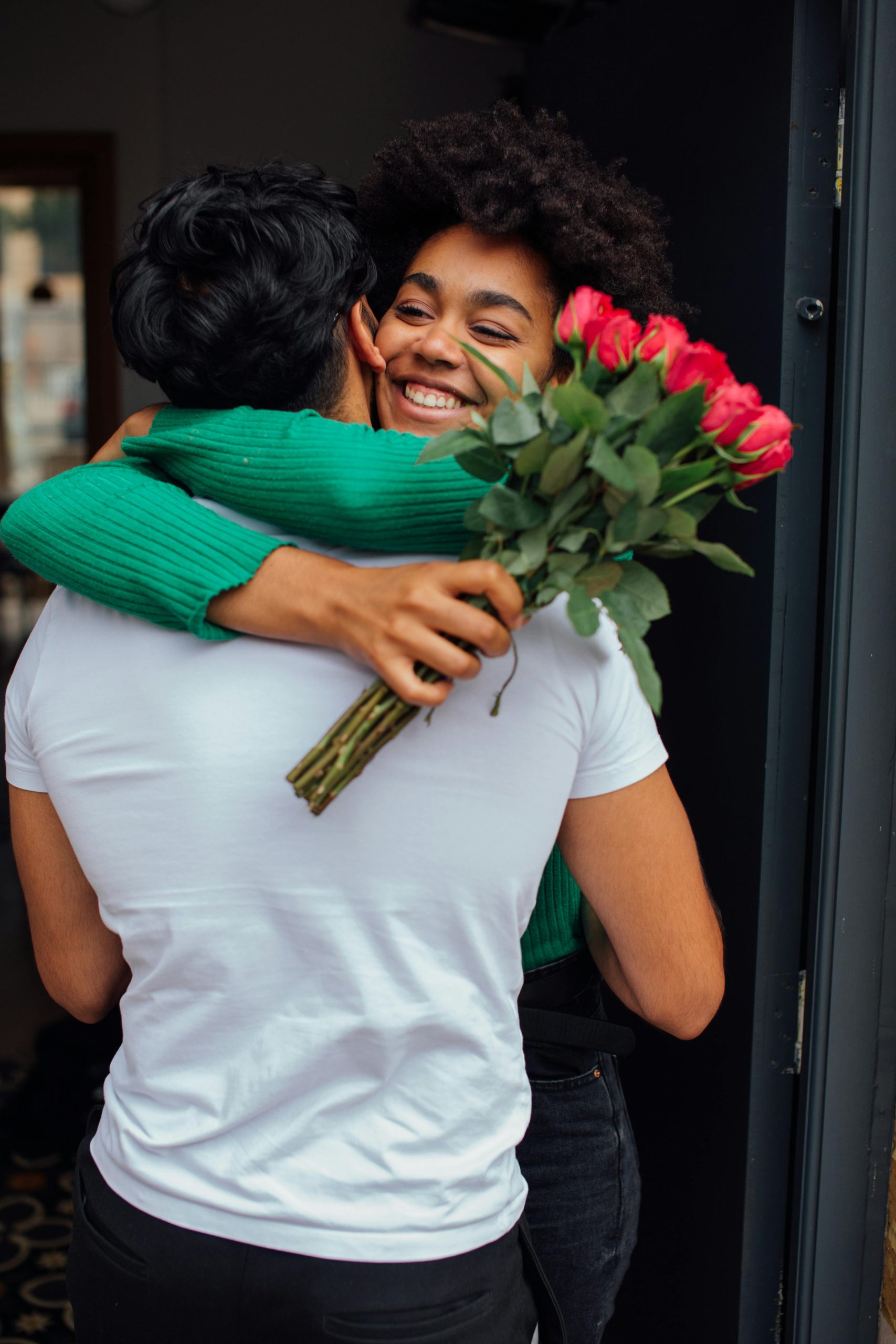 Psychic Solo performing a marriage proposal spell ritual with red candles, a bowl of water and rose petals, and a modern diverse wedding photo.
